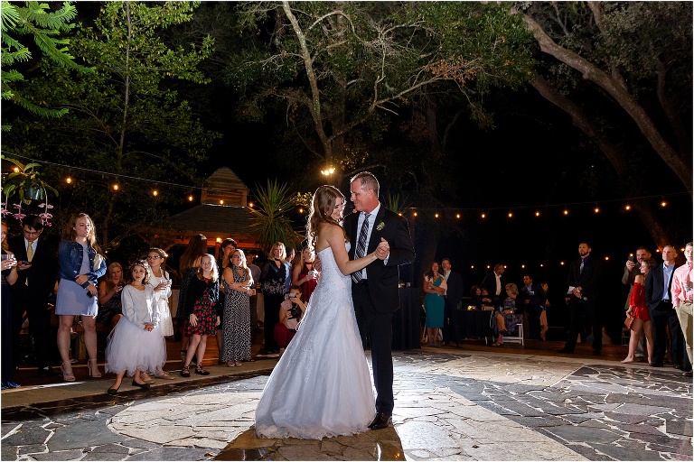 the bride laughs as she dances with her father at her Harmony Gardens wedding reception