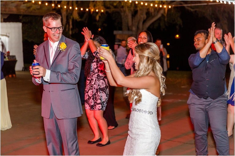 the bride & groom clap during the Casper Slide at their Cottom Farm wedding reception