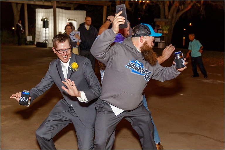 the groom & his best man booty bump during their Cottom Farm wedding reception