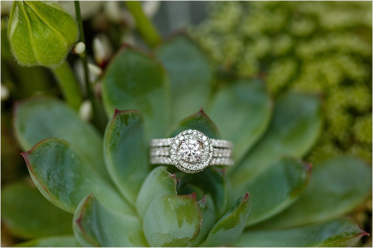 closeup of the bride's ring resting on a succulent in her bouquet