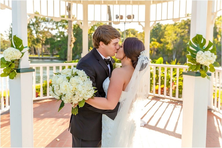 the bride & groom kiss outside the gazebo at their crystal river wedding
