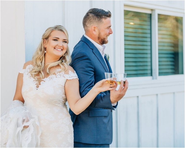 bride and groom take shot during first look