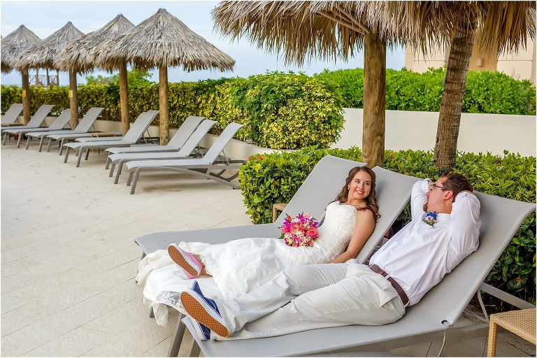 the bride and groom lay back and relax on two beach chairs after their Montego Bay wedding