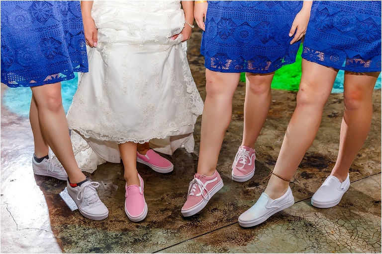 the bride and her bridesmaids show off their variety of pink Vans