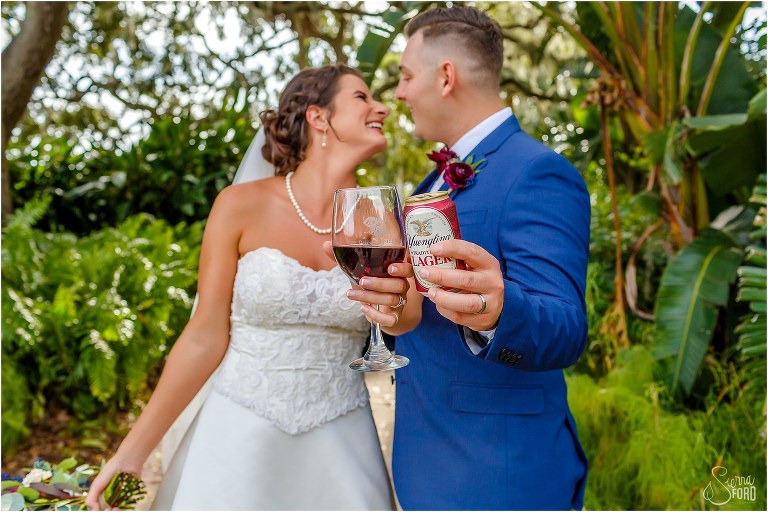 bride & groom cheers after Tavares lakeside wedding