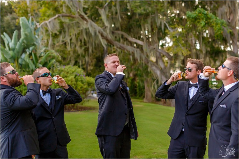 groom & his groomsmen take shots before Mission Inn wedding on Little Lake Harris