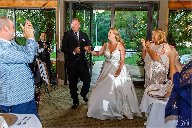 bride & groom announced into Mission Inn wedding reception as loved ones cheer