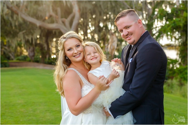 bride, groom & their daughter cheese for the camera at Mission Inn wedding