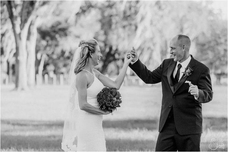 bride & groom laugh as groom shows off his dance moves before Central Florida winery wedding