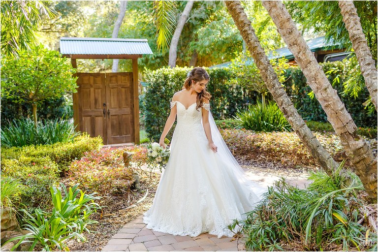 bride twirls in dress in Secret Garden at Club Lake Plantation wedding