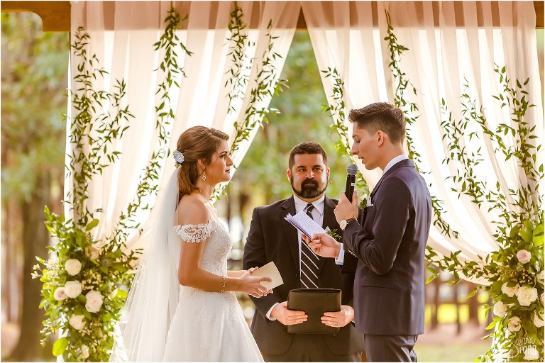 groom recites emotional vows to bride at their Club Lake Plantation wedding ceremony
