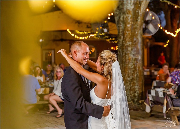 bride & groom look lovingly at each other during first dance at Whispering Oaks winery wedding