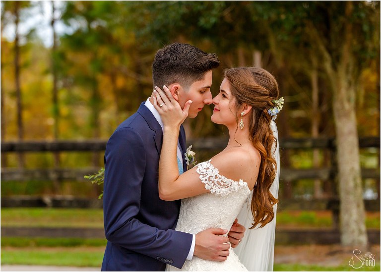 bride & groom nuzzle noses in the warm glow after Club Lake Plantation wedding