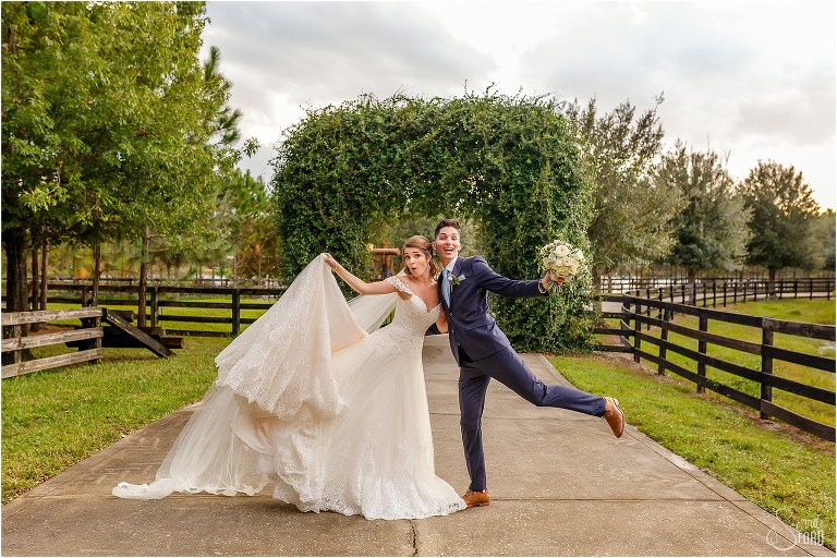 bride & groom strike a goofy pose at Club Lake Plantation wedding
