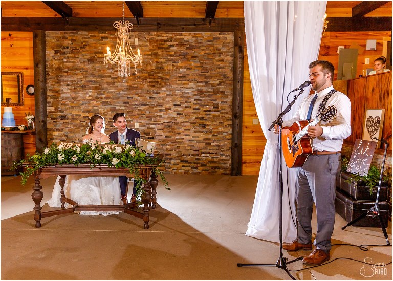 bride's twin brother sings song he wrote for couple at Club Lake Plantation wedding reception