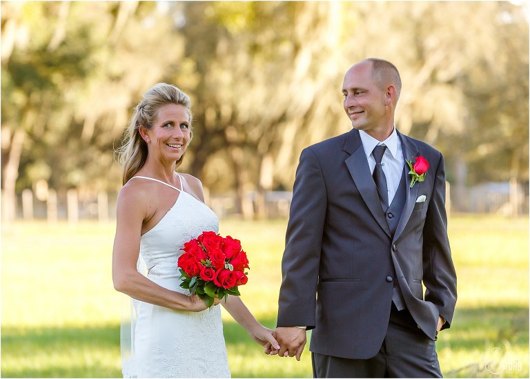 groom looks lovingly at his bride before their Central Florida winery wedding
