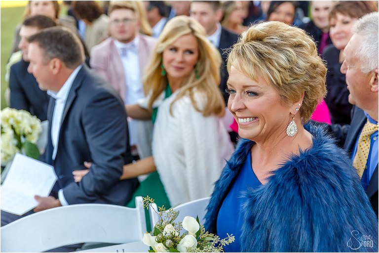mother of the bride beams as daughter comes down the aisle at Amelia Island wedding ceremony