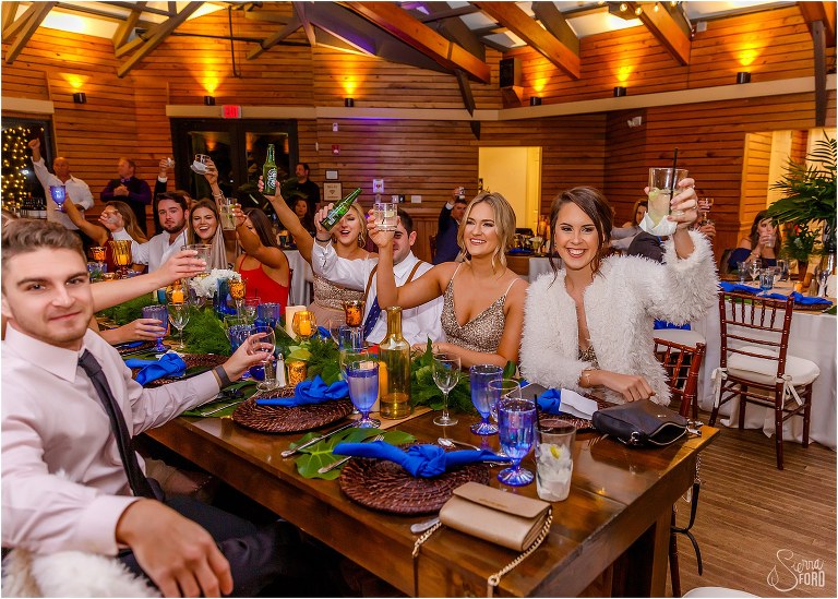 guests cheers as toasts are given at Amelia Island wedding reception