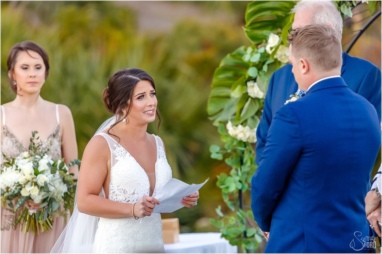 bride says vows to her groom with tears in her eyes at Amelia Island wedding ceremony