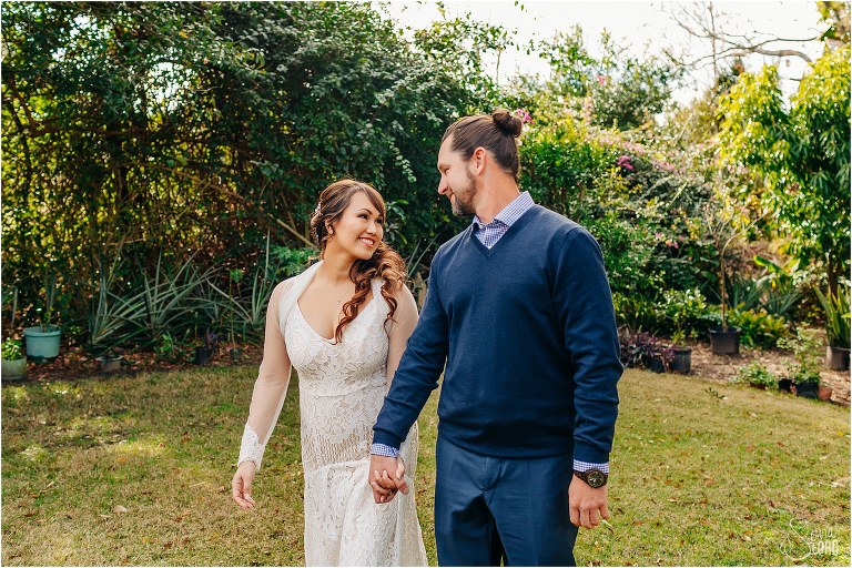 bride & groom walk hand in hand to prepare for Florida elopement
