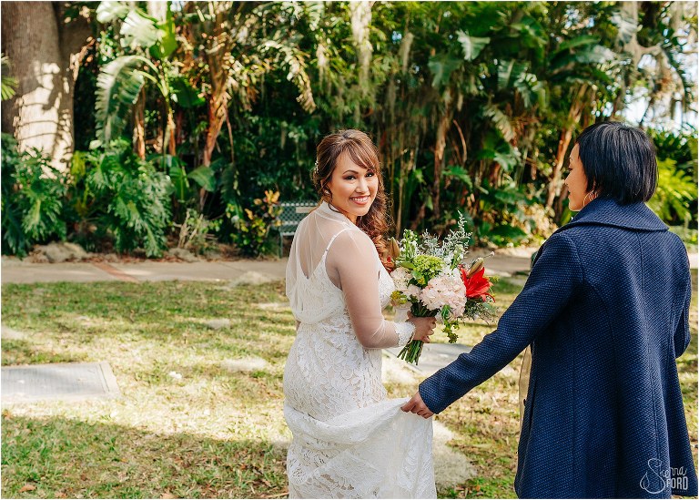 bride beaming as she walks towards ceremony spot for Florida elopement
