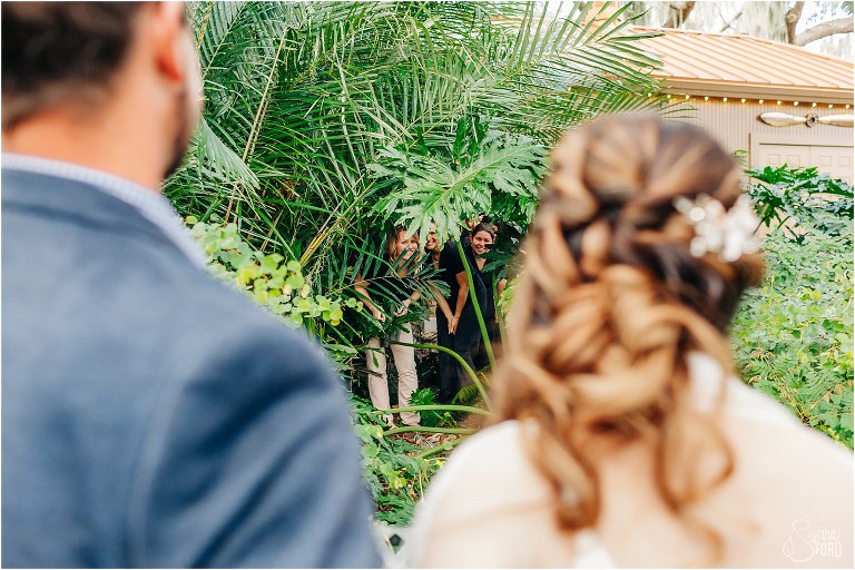 coworkers hide in the bushes to surprise bride & groom at Florida elopement