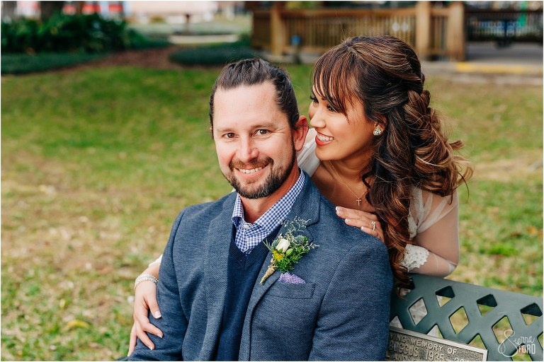 bride whispers something in groom's ear after Florida elopement