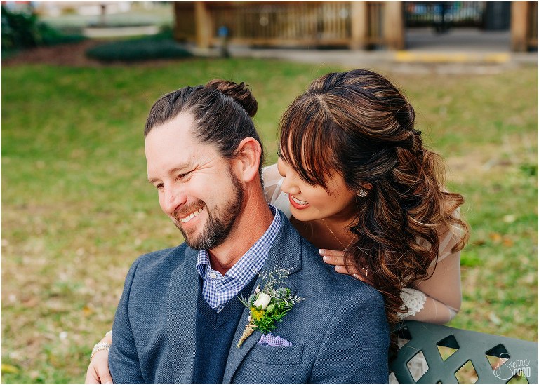 bride & groom laugh together in Wooten Park after Florida elopement