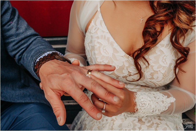 bride plays with groom's wedding ring at Florida elopement