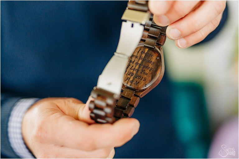 groom shows off inscription of the watch given to him by his bride before Florida elopement