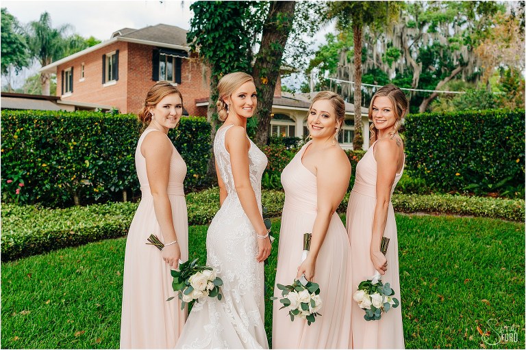 bride & her bridesmaids pose before Town Manor wedding in blush David's Bridal bridesmaids dresses