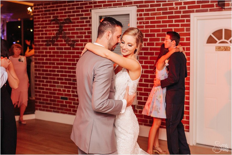 bride & groom share quiet moment on dance floor at Town Manor wedding reception