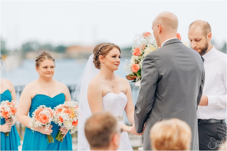 brides tears up as groom says his vows during River House wedding ceremony