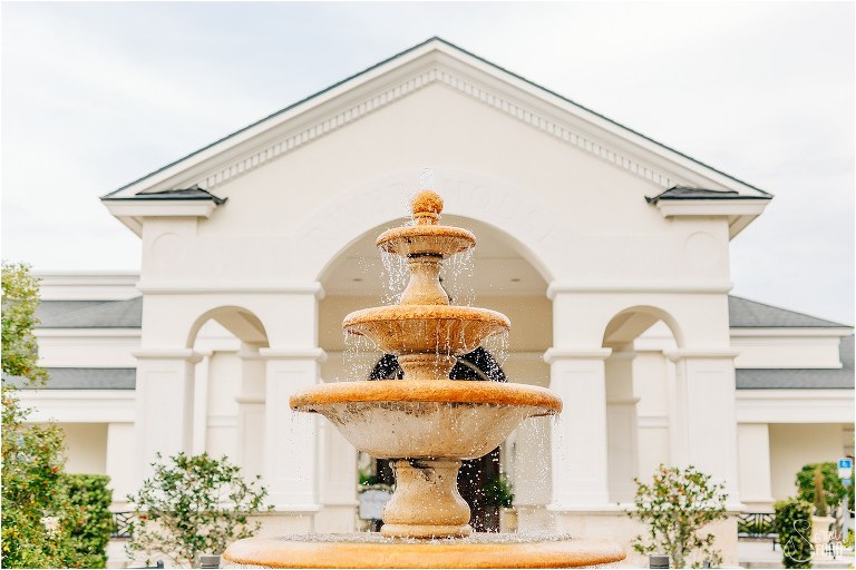 water spills down the fountain at River House wedding