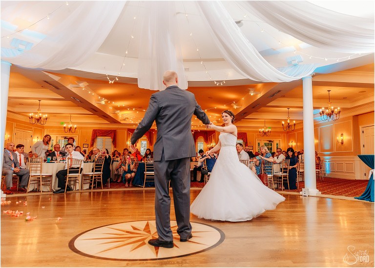 groom spins bride out during first dance at River House wedding reception