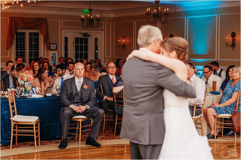 grooms gets emotional as he watches bride dance with her father at River House wedding reception