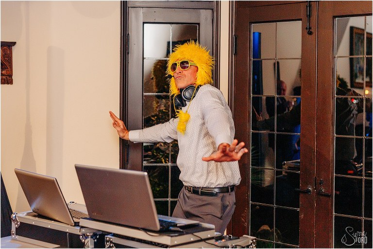 DJ PJ of Atomic Entertainment busts a move in a crazy hat during Winter Park wedding reception