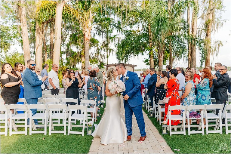 bride & groom kiss at Disney themed wedding ceremony
