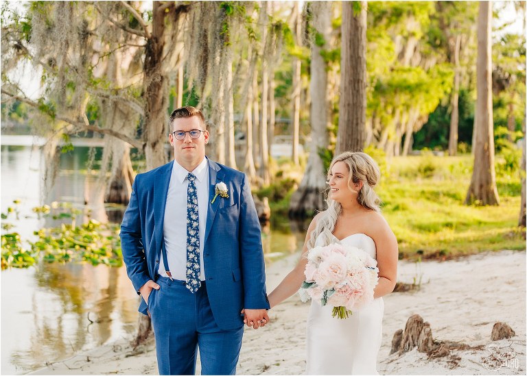 couple on Paradise cove beach at Disney themed wedding