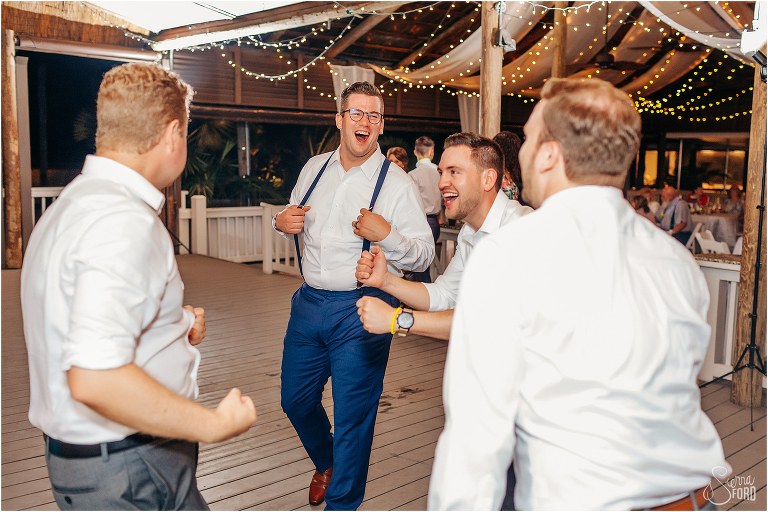 groom laughs as he shares dance with best friends at Disney themed garden wedding reception