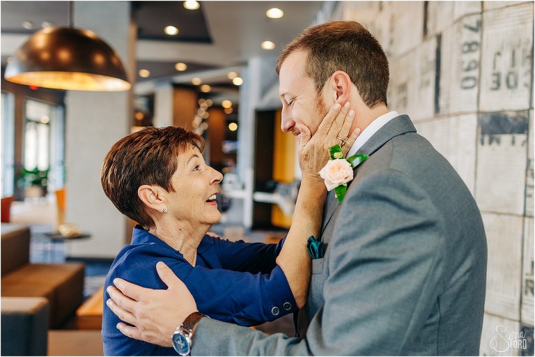 mother of the bride gives groom a hug before Savannah elopement