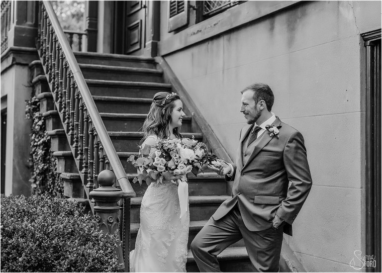 groom leads bride down steps after Savannah elopement