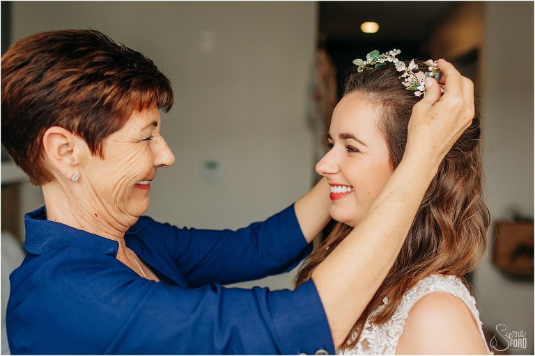 bride beams as mom adjusts her jewel crown before Savannah elopement
