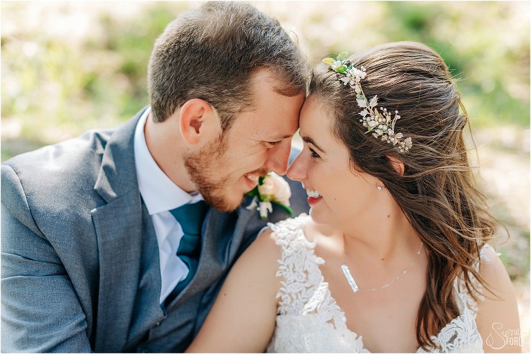 bride & groom nose to nose as they cuddle after Savannah elopement