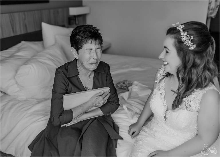 mother of the bride dissolves in emotion over gift from bride before Savannah elopement
