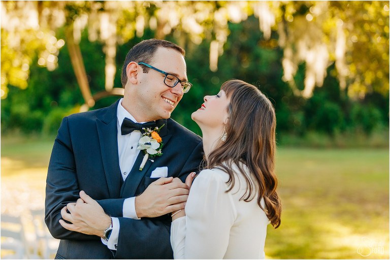 groom laughs as bride gets cutesy at elegant backyard elopement