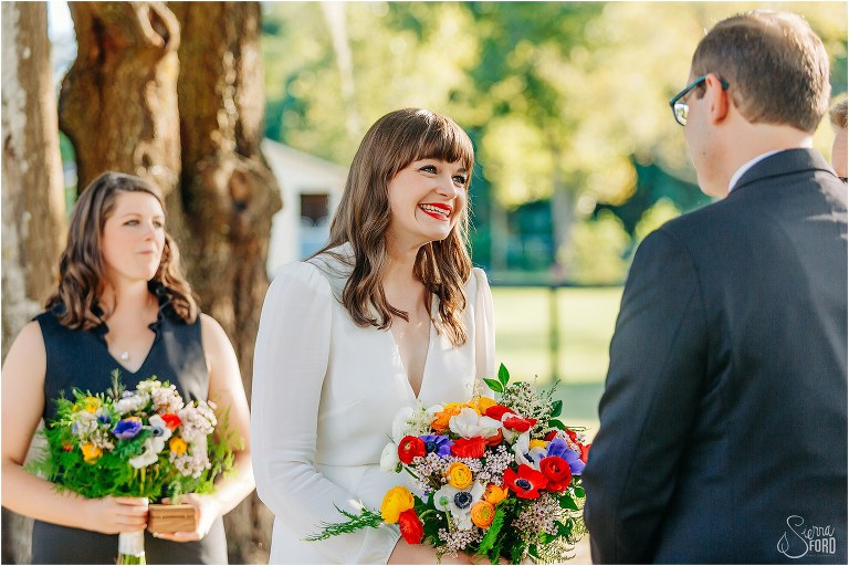 bride grins at groom during elegant florida elopement ceremony