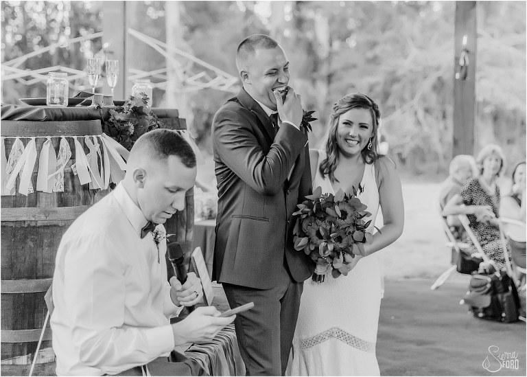 bride & groom laugh hysterically at heartfelt best man speech at DIY Florida Barn Wedding reception