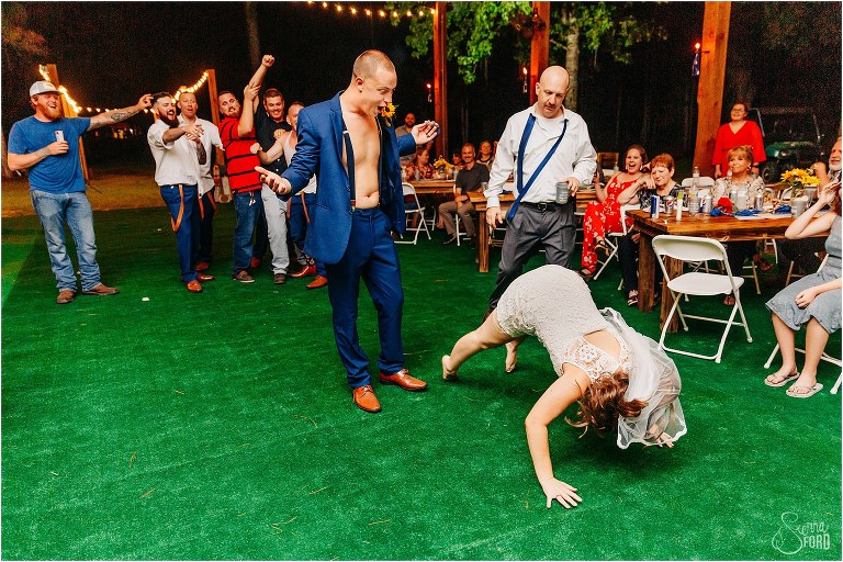 groom surprised at bride's worm dance at DIY Florida Barn Wedding reception