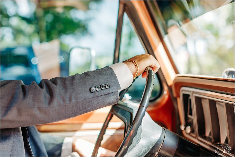 groom takes the wheel of his 1978 F-250 truck before Horsepower Ranch wedding